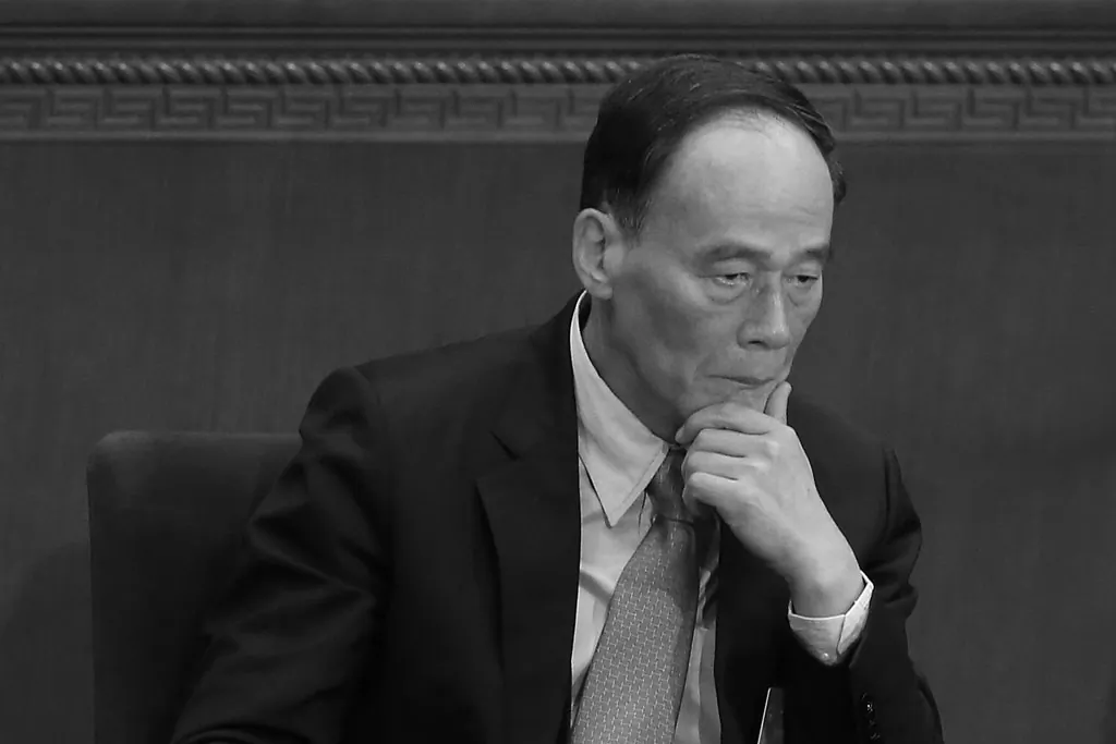 Wang Qishan, head of the Chinese regime's anti-corruption campaign, attends a meeting in Beijing, on March 5, 2014. (Feng Li/Getty Images)
