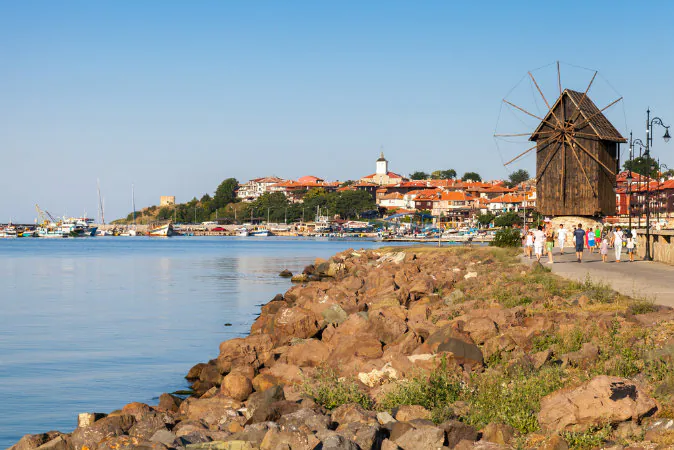 Coastal landscape with old windmill. Ancient town Nessebar, Bulgaria via Shutterstock*