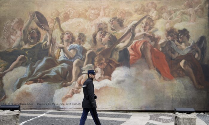 A gendarme from the Vatican security forces patrols St. Peter’s Square at the Vatican on Jan. 25, 2015. (AP Photo/Gregorio Borgia)