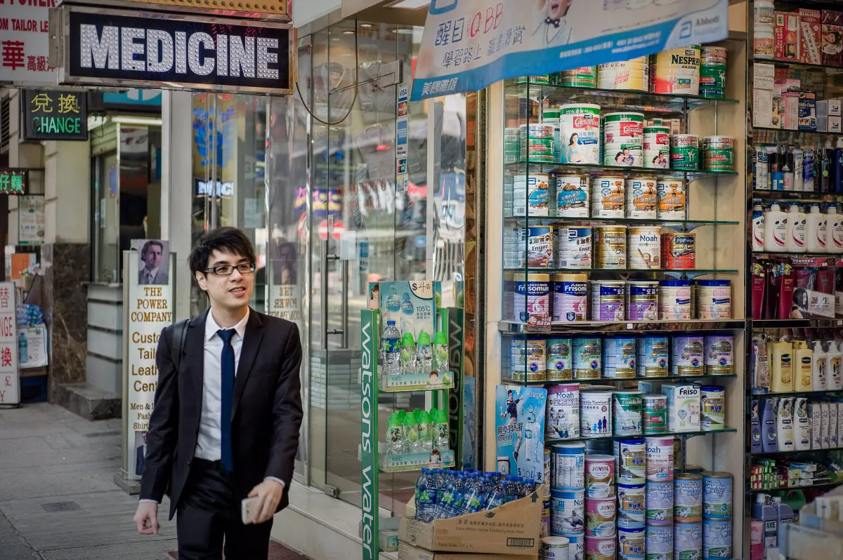 A man walks past a display of baby formula in Hong Kong on Jan. 30, 2013. (Philippe Lopez/AFP/Getty Images)