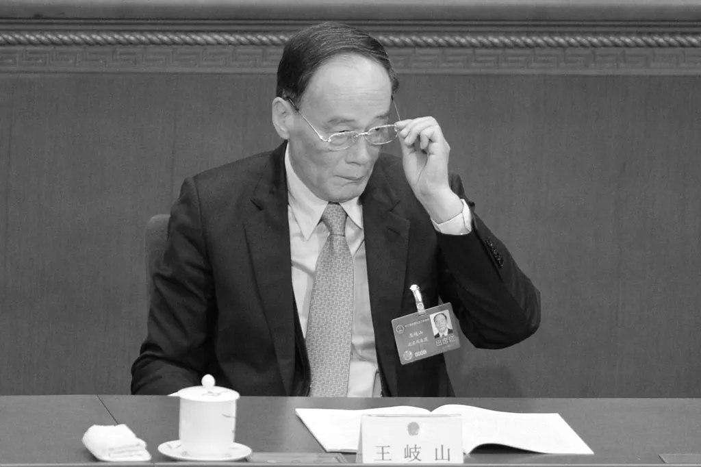 Wang Qishan, Secretary of the CPC Central Commission for Discipline Inspection (CCDI), attends the opening session of the 12th National People's Congress (NPC) in the Great Hall of the People in Beijing on March 5, 2014. (Wang Zhao/AFP/Getty Images)