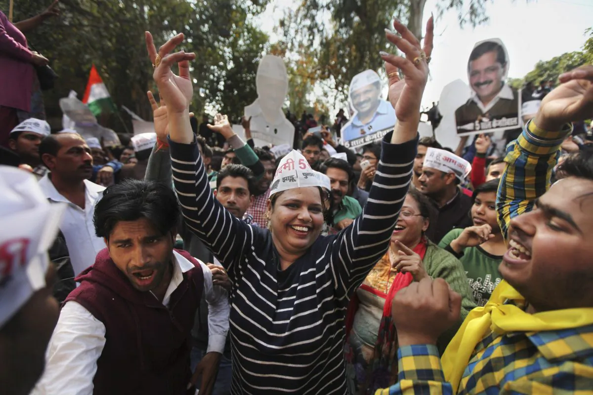 Supporters of the Aam Aadmi Party, or Common Man’s Party, dance as they celebrate their party's victory in New Delhi, India, on Feb. 10, 2015. (AP Photo/Altaf Qadri)