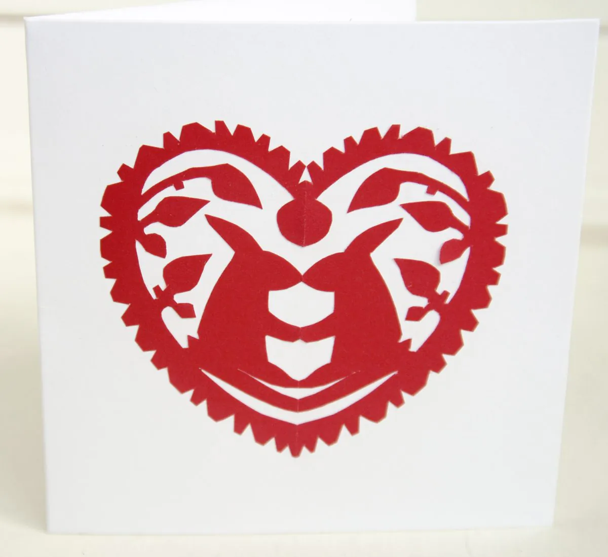A simple design cut from bright coloured paper and mounted on white card can make a striking greetings card (Kat Piper/Here and Far)