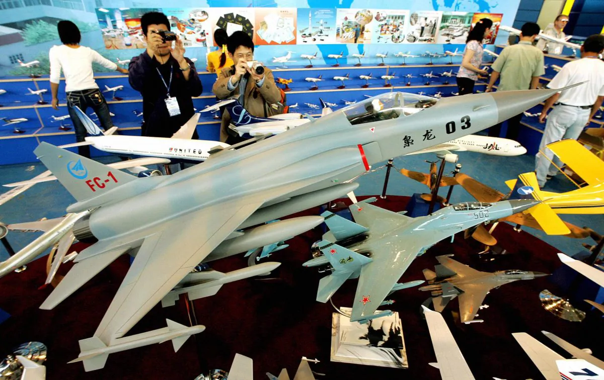 A model of the FC-1, one of the Chinese regime's fighter jets, is shown on display at China's Zhuhai Airshow on Oct. 31, 2004. The Chinese regime may start developing FC-1 jets alongside Argentina. (Mike Clarke/AFP/Getty Images)