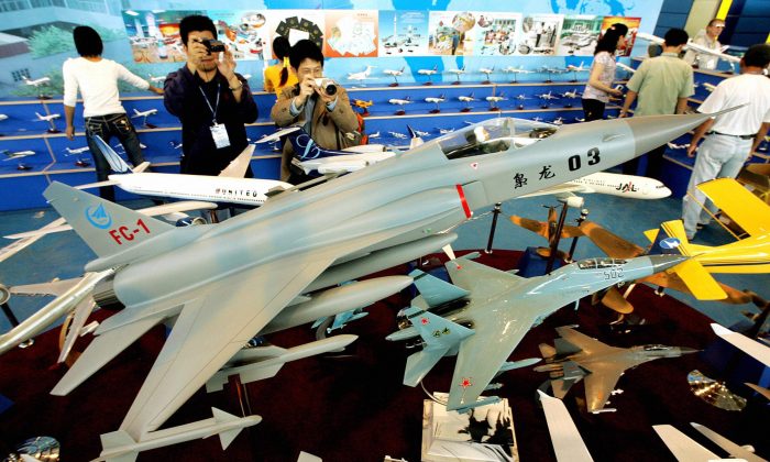 A model of the FC-1, one of the Chinese regime's fighter jets, is shown on display at China's Zhuhai Airshow on Oct. 31, 2004. The Chinese regime may start developing FC-1 jets alongside Argentina. (Mike Clarke/AFP/Getty Images)