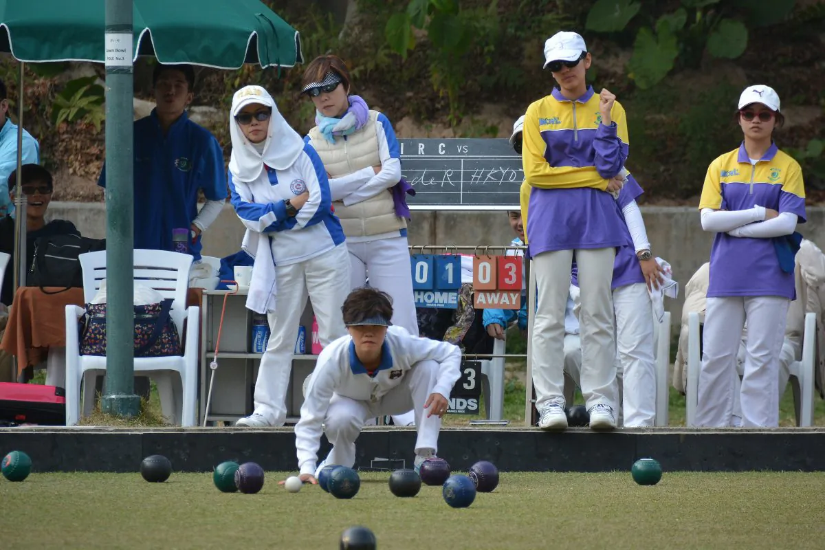 Tammy Tham (front) of Club de Recreio watching anxiously to a bowl delivered by her skip during the semi-final of the National Fours against the Hong Kong Youth Team at Indian Recreation Club on Sunday Feb 8, 2015. The CdeR team came from behind to beat the youngsters 22:20. (Stephanie Worth)