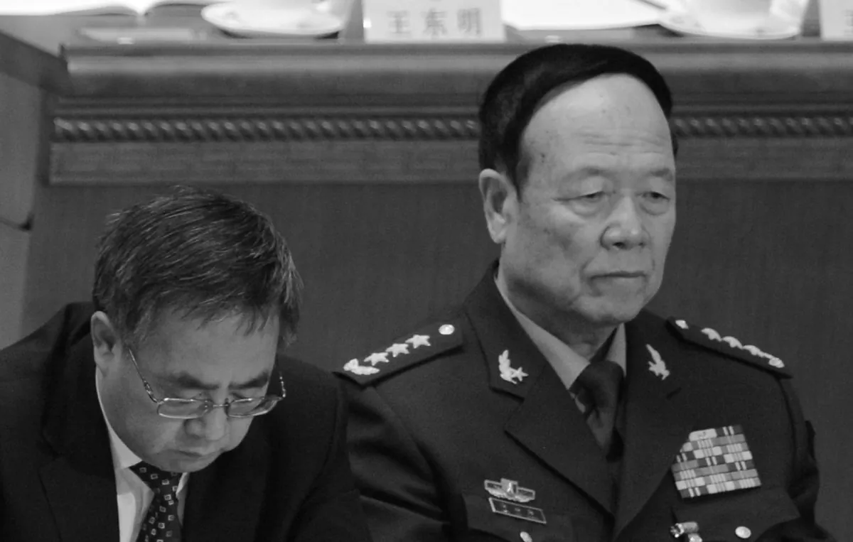 The Communist Party secretary of Guangdong province, Hu Chunhua (L), and Vice Chairman of the Central Military Commission Guo Boxiong. Guo may be the next target of the campaign against corruption in the military. (Goh Chai Hin/AFP/Getty Images)