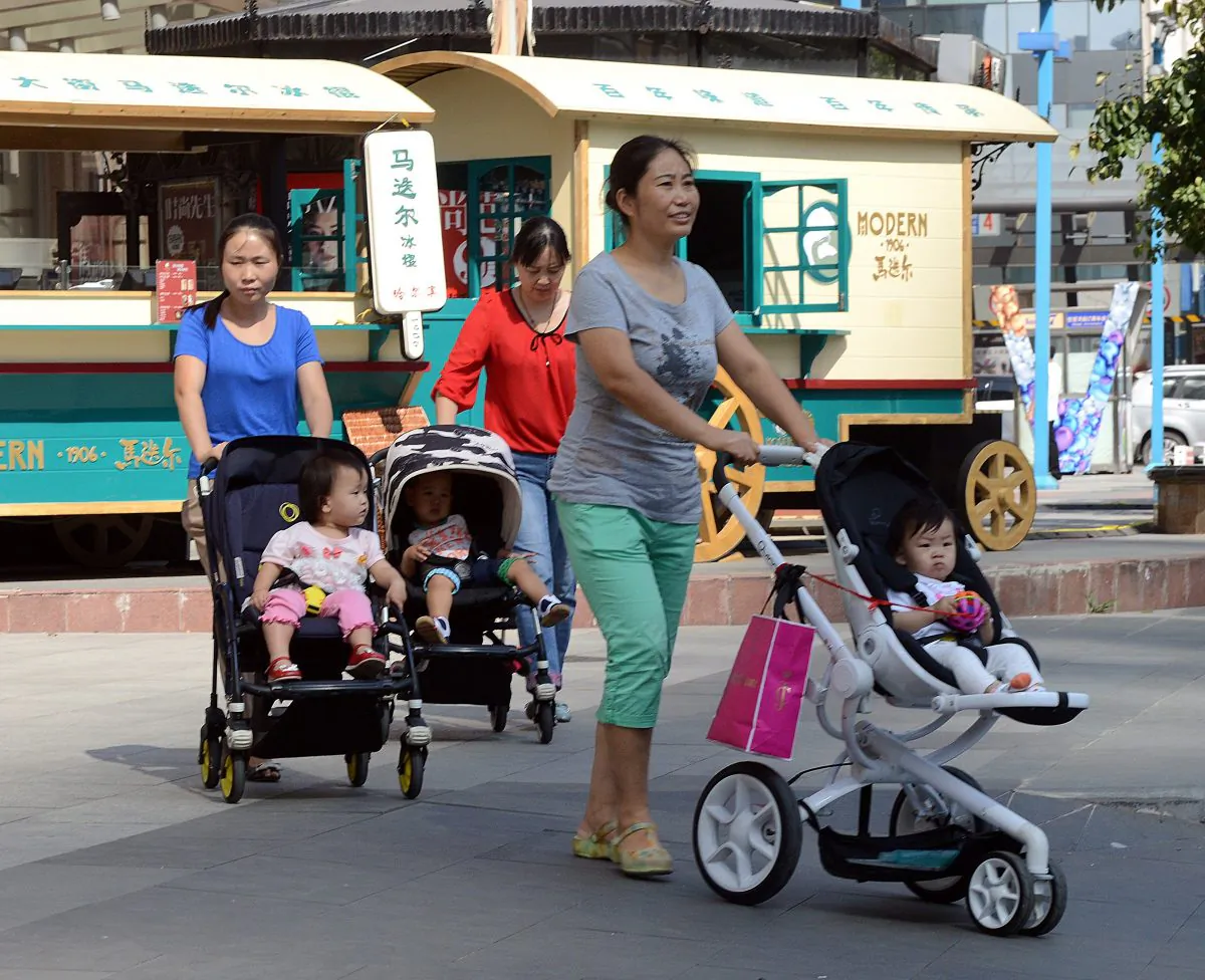A group of Chinese women take their babies for a stroll outside a shopping mall in Beijing on Oct. 18, 2014. China’s sex ratio at birth in 2014 was 115.88 boys to 100 girls, highest in the world, according to state-run media Xinhua. (Goh Chai Hin/AFP/Getty Images)