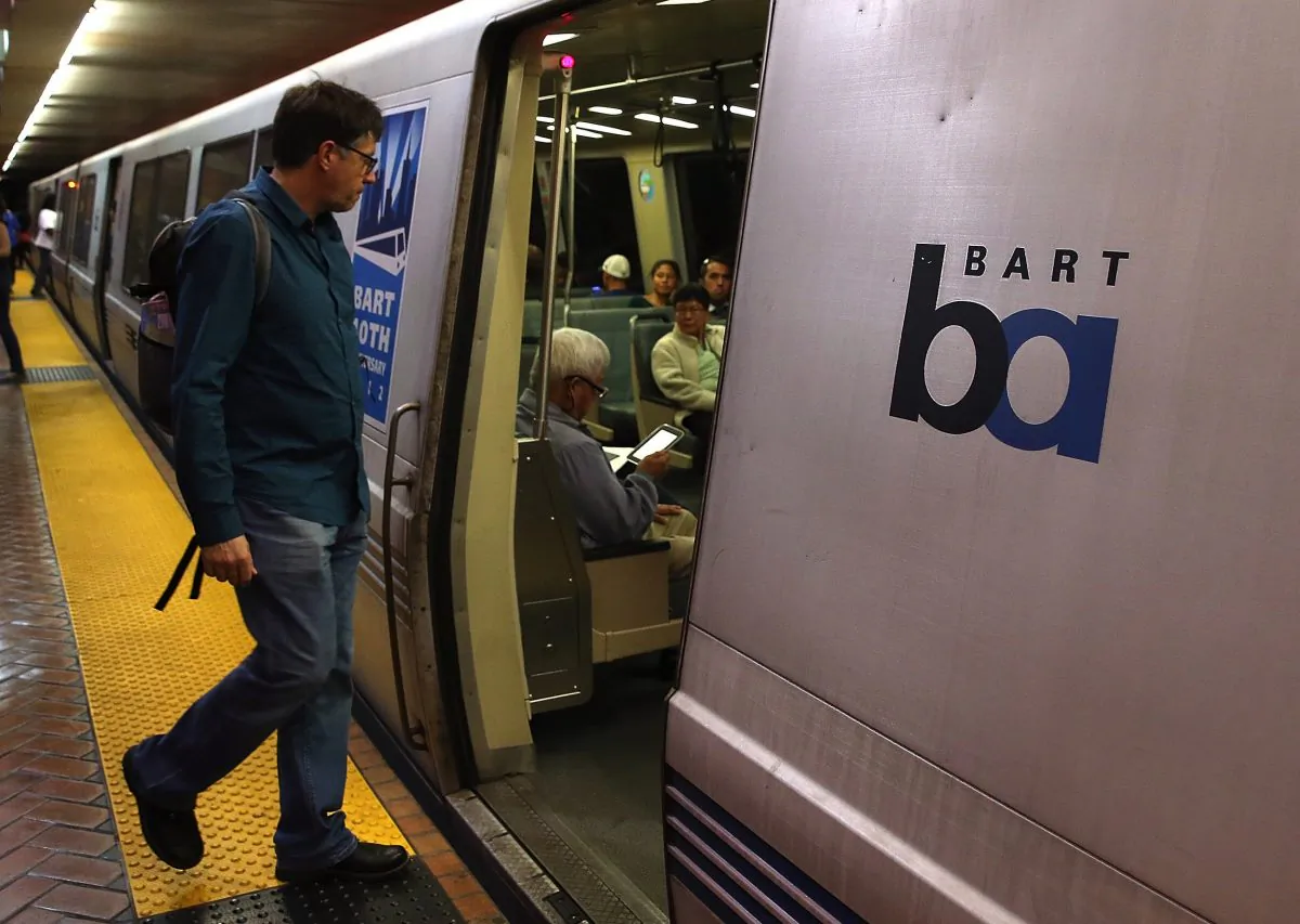 A Bay Area Rapid Transit (BART) passenger boards a train on October 15, 2013 in San Francisco, California. (Photo by Justin Sullivan/Getty Images)