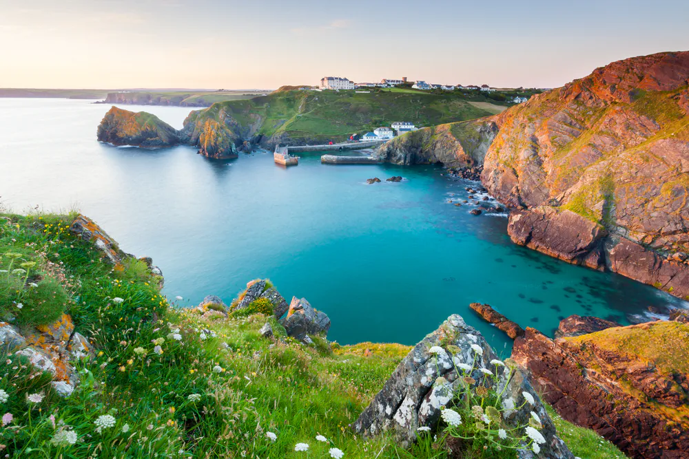 Sunset overlooking Mullion Cove Cornwall England UK via Shutterstock*