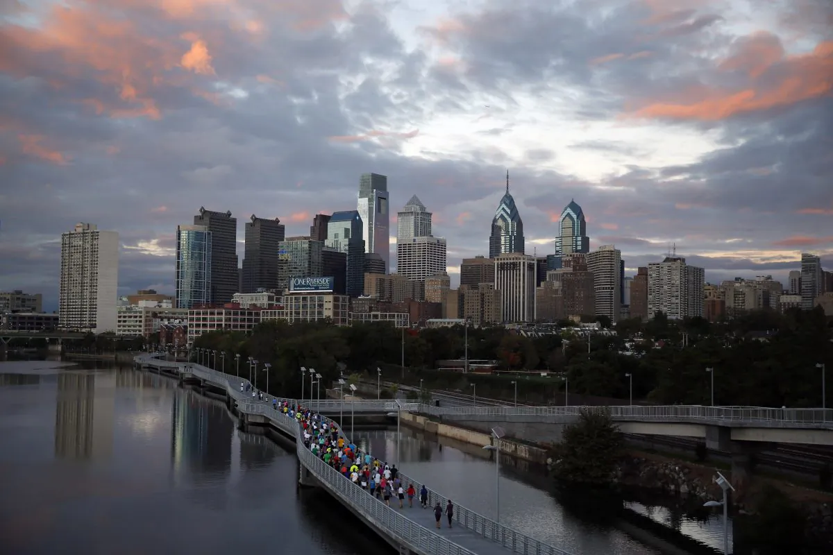 In this Oct. 1, 2014 file photo, runners jog along the Schuylkill Banks Boardwalk in Philadelphia. (Matt Slocum/AP Photo)