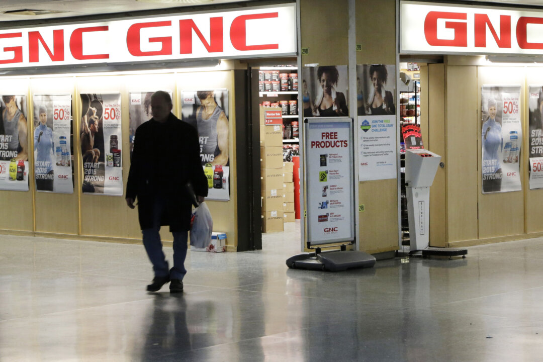 A man leaves a GNC store in New York, on Feb. 3, 2015. The New York Attorney General is investigating GNC, Target, Walmart, and Walgreen Co. for selling supplements that either couldn’t be verified to contain the labeled substance or that contained ingredients not listed on the label. (AP Photo/Mark Lennihan)