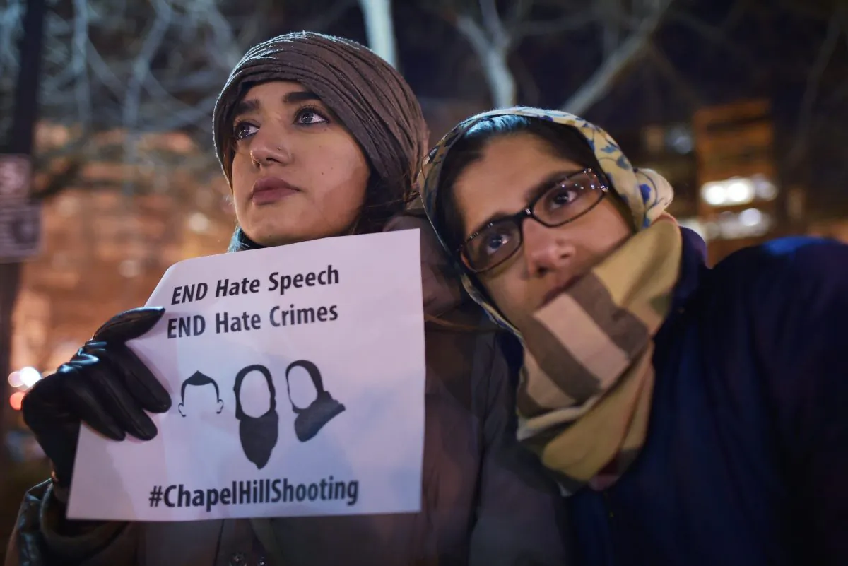 Women take part in a vigil for three young Muslims killed in Chapel Hill, North Carolina, at Dupont Circle on February 12, 2015 in Washington, DC. (Mandel Ngan/AFP/Getty Images)