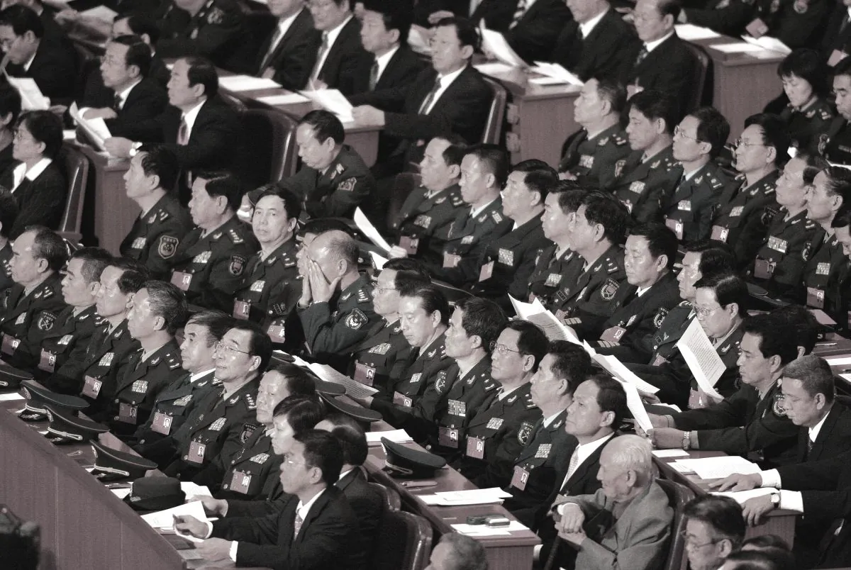 Chinese Communists at 17th Party Congress inside the Great Hall of the People in Beijing October 21, 2007. Chinese communist officials rampantly faked their personal records in order to get better chances for bonuses and promotions. (Frederic J. Brown/AFP/Getty Images)