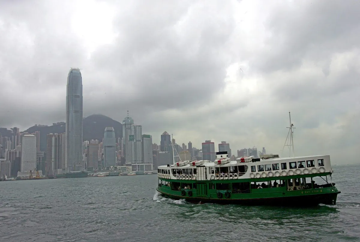 Tourists and commuters take a Ferry across Hong Kong's Victoria Harbor, May 12, 2005. (AP Photo/Vincent Yu)