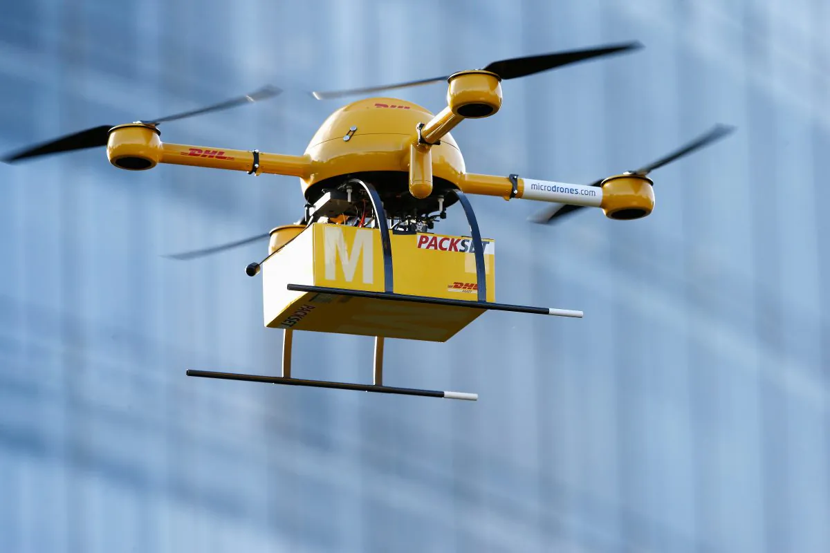 A quadcopter drone flies near Deutsche Post headquarters on December 9, 2013 in Bonn, Germany. It can carry human riders if they happen to weigh only a few ounces. (Andreas Rentz/Getty Images)