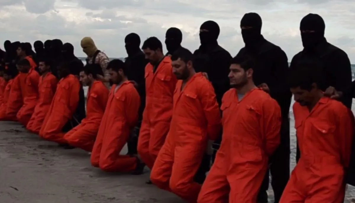The Islamic State, or ISIS, has posted a video showing the apparent beheadings of 21 Egyptian Coptic Christians in Libya. (Screenshot from the ISIS video)