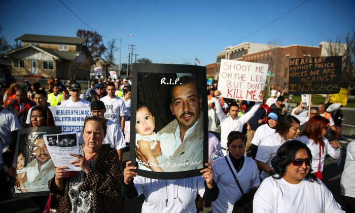People march during a rally for Antonio Zambrano-Montes, Saturday, Feb. 14, 2015, in Pasco, Wash. Zambrano-Montes was shot and killed by Pasco police on Tuesday. (AP Photo/seattlepi.com, Joshua Trujillo) 