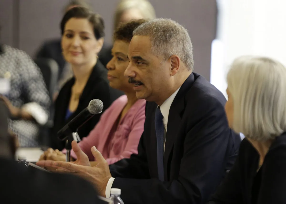 U.S. Attorney General Eric Holder speaks during a police-community relations roundtable with elected officials and community leaders Thursday, Feb. 5, 2015, in Oakland, Calif. The Department of Justice is intervening in a class-action lawsuit against Clanton, Ala. for unconstitutional bail-setting practices. (AP Photo/Eric Risberg)