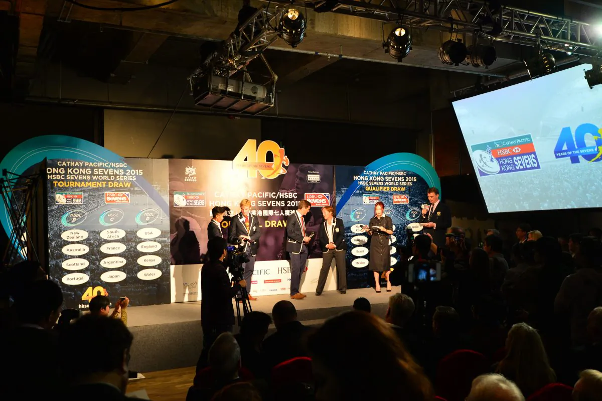 Key members of the Hong Kong squads discuss the draw for the Cathay Pacific/HSBC Hong Kong Sevens 2015 following its completion on Monday Feb 16. (Bill Cox/Epoch Times)