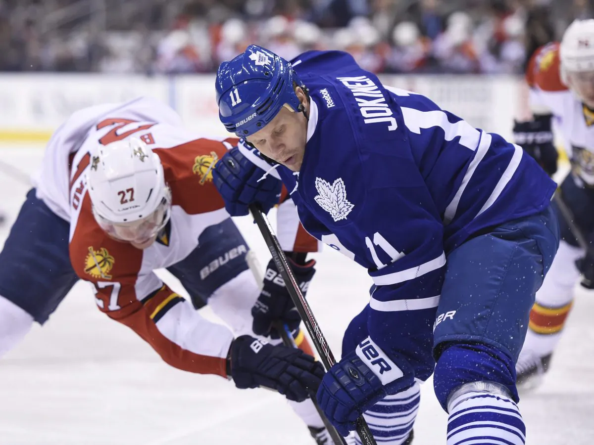 Olli Jokinen faces off against Nick Bjugstad as the Toronto Maple Leafs host the Florida Panthers in Toronto on Feb. 17, 2015. (The Canadian Press/Frank Gunn)