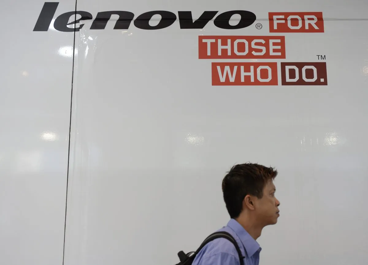 A man walks past Lenovo advertising at a computer centre in Hong Kong on August 14, 2014. (Dale de la Rey/AFP/Getty Images)