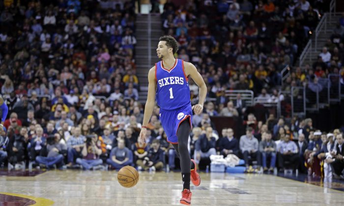 Philadelphia 76ers' Michael Carter-Williams (1) brings the ball into the forecourt in an NBA basketball game against the Cleveland Cavaliers Monday, Feb. 2, 2015, in Cleveland. (AP Photo/Mark Duncan)