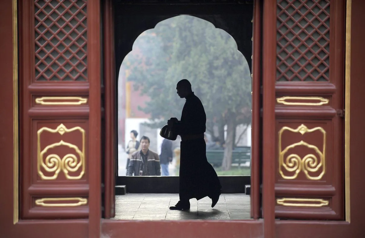 A monk at the Yonghegong Lama temple in Beijing in Beijing on October 24, 2012. Many Chinese officials, seeking advice for their careers, have built friendships with monks and qigong masters in recent years. (Wang Zhao/AFP/Getty Images)