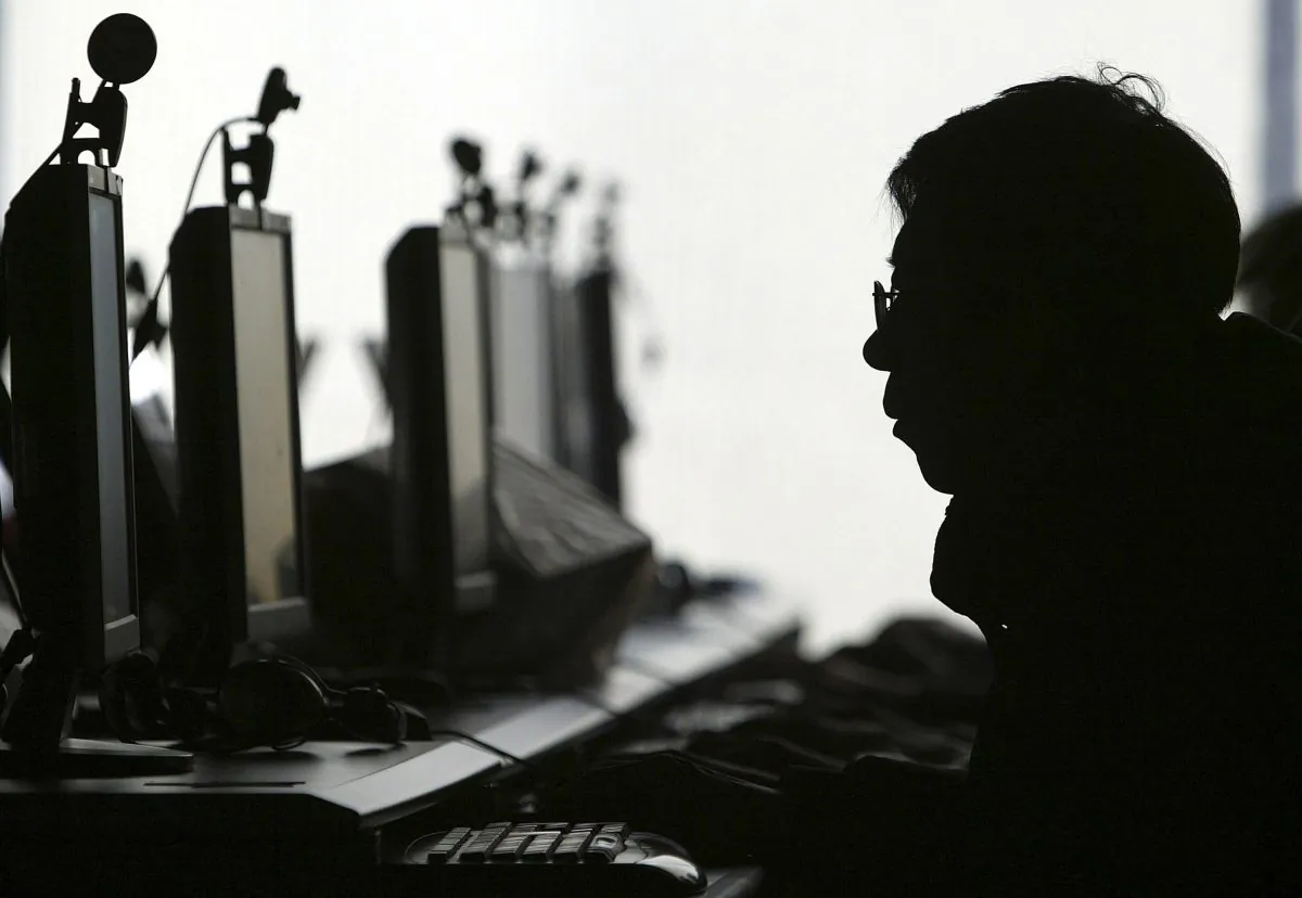 A person uses a computer in an Internet cafe in Shenyang, China, in this file photo. (AP Photo)