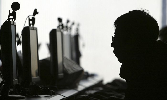 A person uses a computer in an Internet cafe in Shenyang, China, in this file photo. (AP Photo)