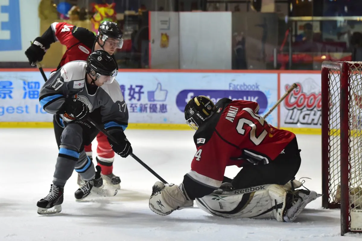 This attack by Sharks’ dealt with successfully by by Warriors’ keeper Jason Awalt in their first, best of 3, CIHL Semi-final at Mega Ice On Saturday Feb 14, 2015. (Bill Cox/Epoch Times)