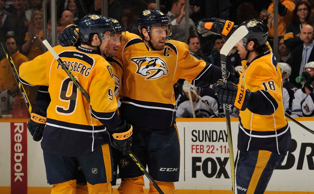 Filip Forsberg (L) and James Neal (R) of the Nashville Predators congratulate teammate Shea Weber on scoring a goal against the Winnipeg Jets during the first period of a game at Bridgestone Arena on February 12, 2015 in Nashville, Tennessee. (Frederick Breedon/Getty Images) 