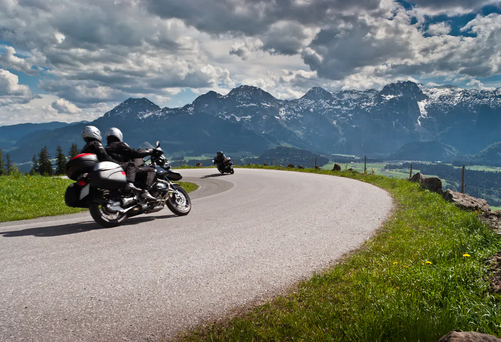 Motorbikes on the road in mountains with Alps in background.Salzkammergut,Austria via Shutterstock*