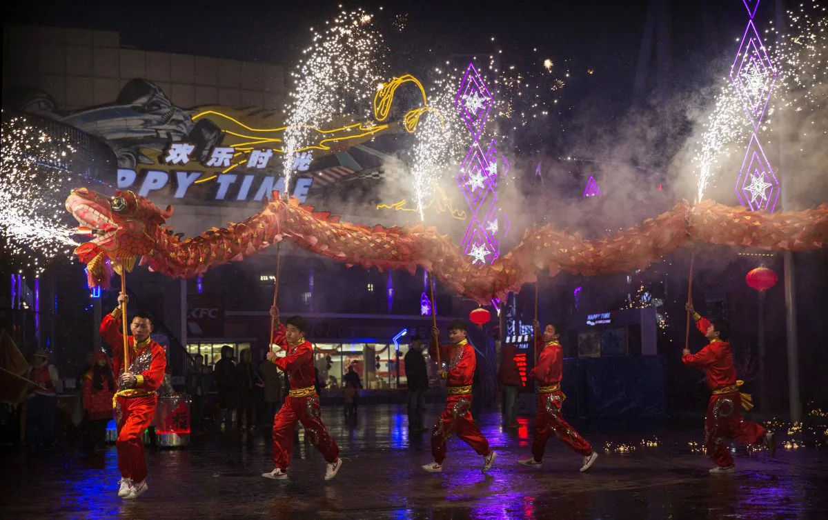 Chinese artists perform a dragon dance at a local amusement park during celebrations for the Lunar New Year February 19, 2015 in Beijing. Dozens of Chinese netizens raised a petition calling for the cancellation of CCTV’s Chinese New Year Gala, condemning the performances’ discriminatory and sexist content. (Kevin Frayer/Getty Images)