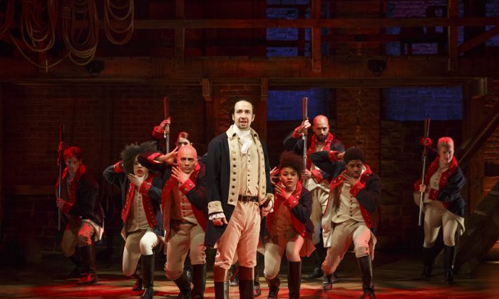 In this image released by The Public Theater, Lin-Manuel Miranda, center, performs in the musical "Hamilton" at The Public Theater in New York. (AP Photo/The Public Theater, Joan Marcus)