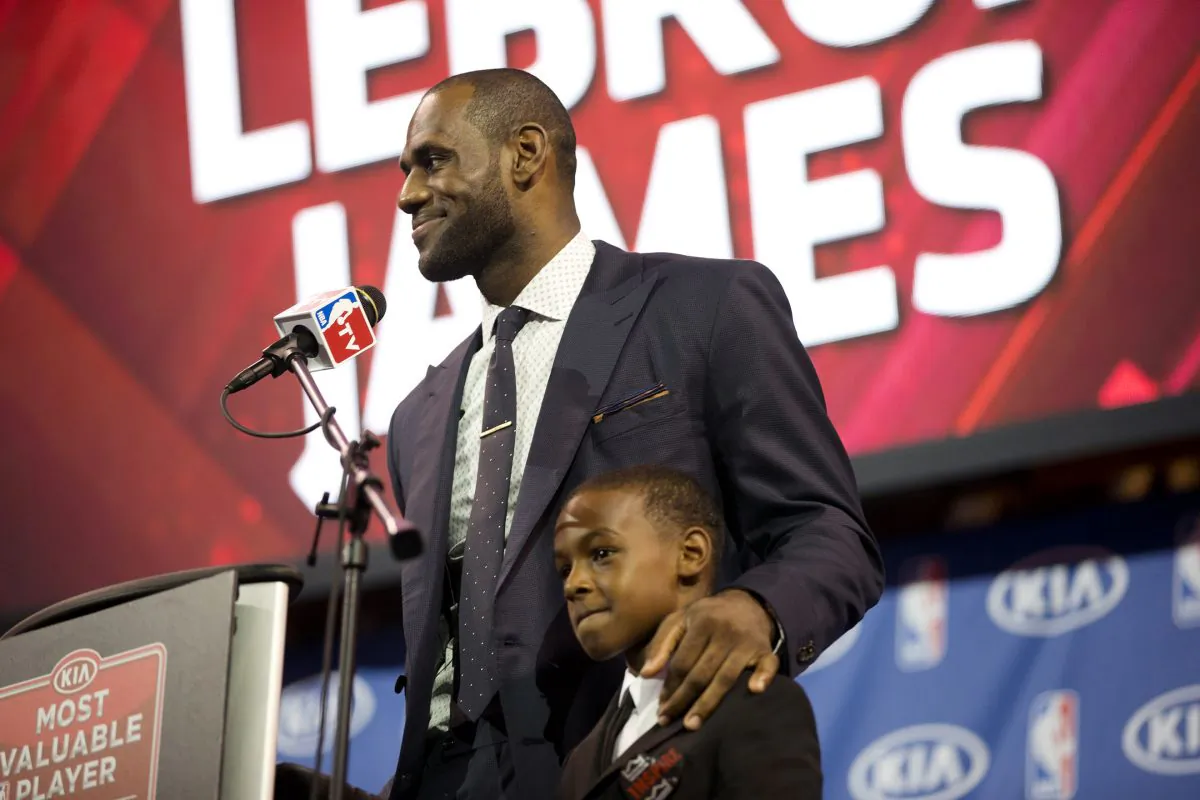 Miami Heat's LeBron James stands with his son, LeBron Jr., during an NBA basketball news conference, Sunday, May, 5, 2013, in Miami.. (AP Photo/J Pat Carter) 