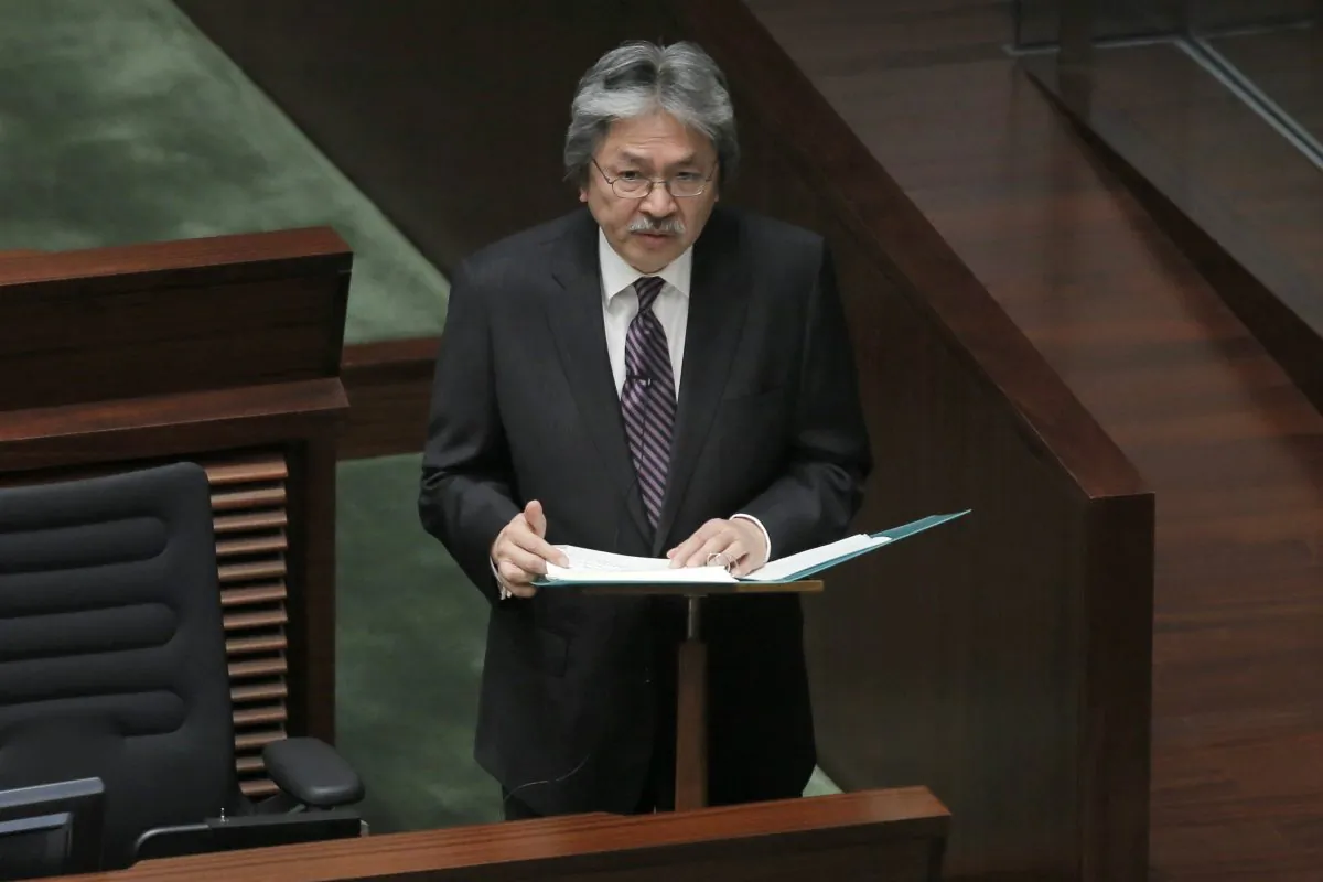 Hong Kong's Financial Secretary John Tsang delivers his annual budget speech at the Legislative Counci in Hong Kong on Feb. 25, 2015. (AP Photo/Vincent Yu)
