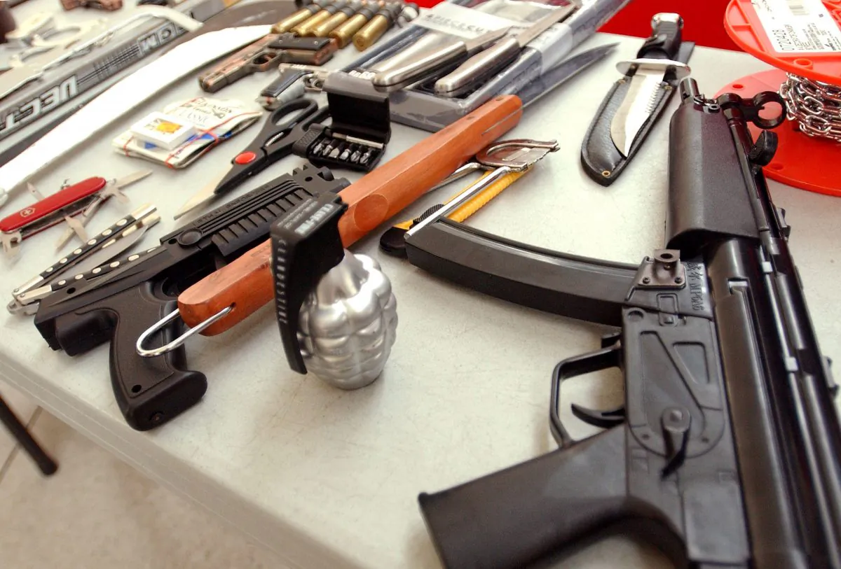 A mix of toy and real weapons that were confiscated from 2002-2003 at the John F. Kennedy Airport in New York. (Stephen Chernin/Getty Images)