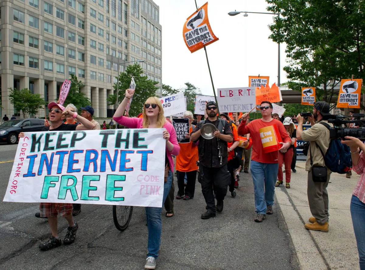 Protesters hold a rally to support 'net neutrality' and urge the Federal Communications Commission (FCC) to reject a proposal that would allow Internet service providers to create internet fast lanes, on May 15, 2014 at the FCC in Washington, DC. (KAREN BLEIER/AFP/Getty Images)