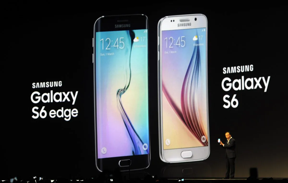 JK Shin, CEO of Samsung's mobile division, shows the new Galaxy S6 and S6 Edge, during a Samsung Galaxy Unpacked 2015 event on the eve of this weeks Mobile World Congress wireless show, in Barcelona, Spain, March 1, 2015. (Manu Fernandez/AP Photo)