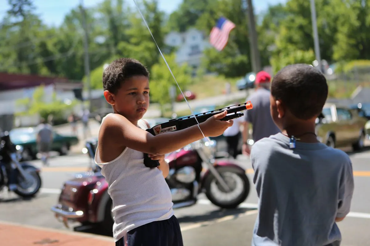 Children play with a toy gun during Fourth of July celebrations in Liberty, N.Y., in 2012. (John Moore/Getty Images)