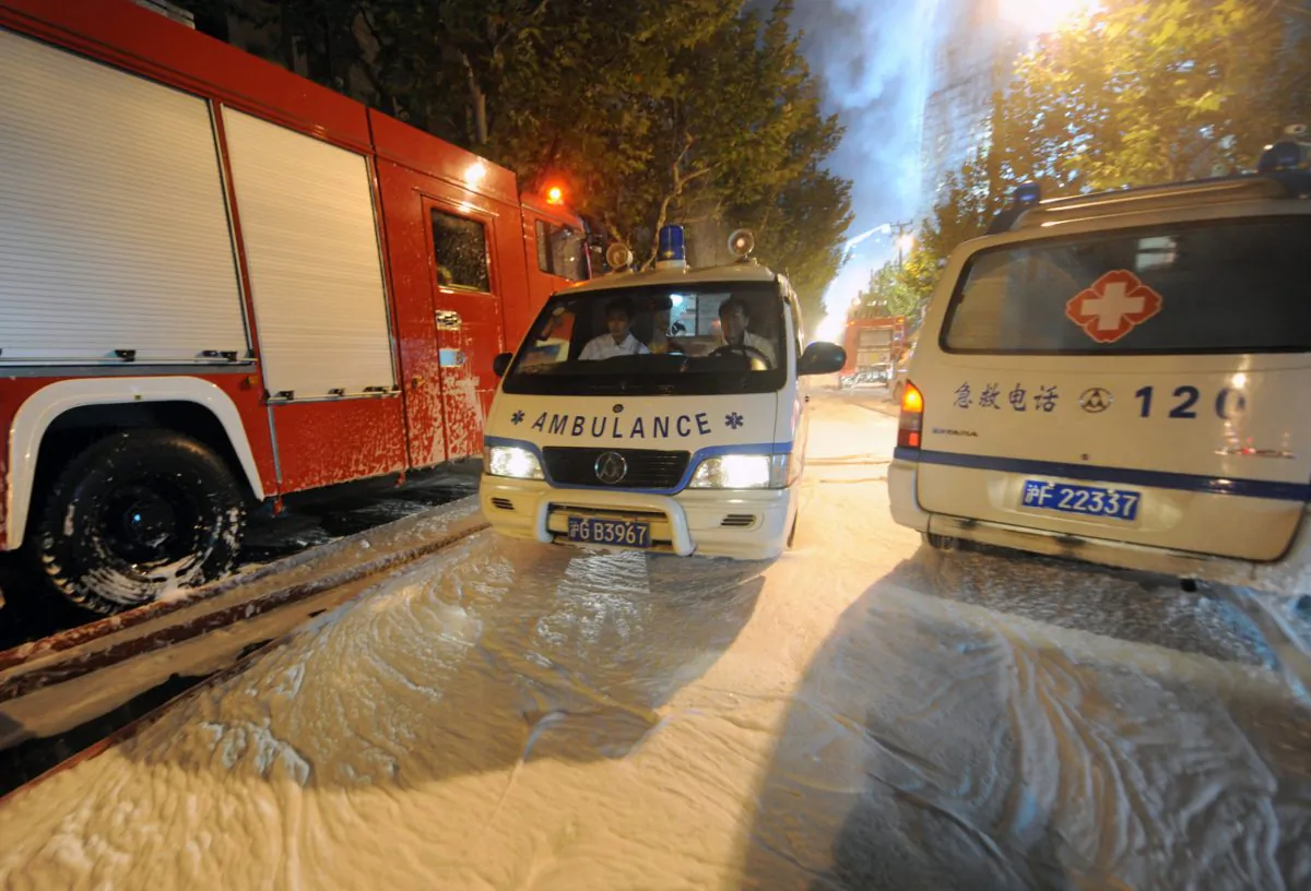 Medical personnel sit in an ambulance in Shanghai on Nov. 15, 2010. Counterfeit ambulance services have popped up in China in the last few years, confusing and endangering patients. (STR/AFP/Getty Images) 