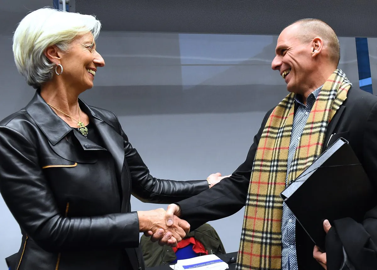 Greek Finance Minister Yanis Varoufakis (R) shakes hands with International Monetary Fund (IMF) Director Christine Lagarde during an emergency Eurogroup finance ministers meeting at the European Council in Brussels on Feb. 11, 2015. (Emmanuel Dunand/AFP/Getty Images)