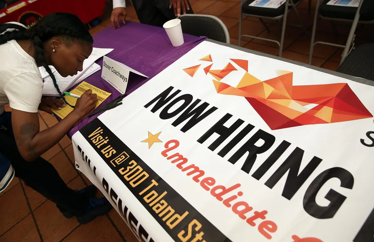 A job seeker fills out an application during a career fair in San Francisco, on May 21, 2014. (Justin Sullivan/Getty Images)
