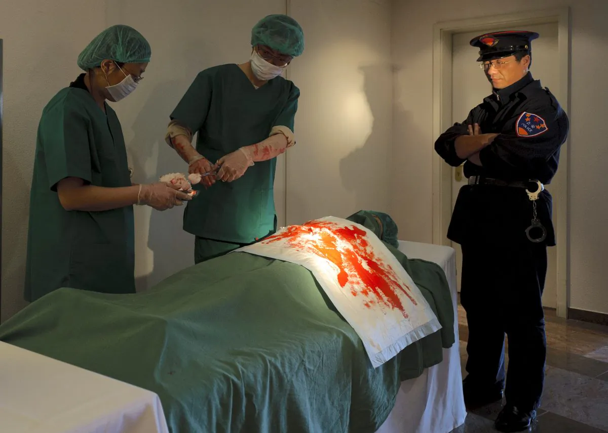 Falun Gong practitioners perform a re-enactment of organ harvesting during a rally of the International Society for Human Rights in Cottbus, Germany, on April 14, 2012. (Robert Michael/AFP/Getty Images)