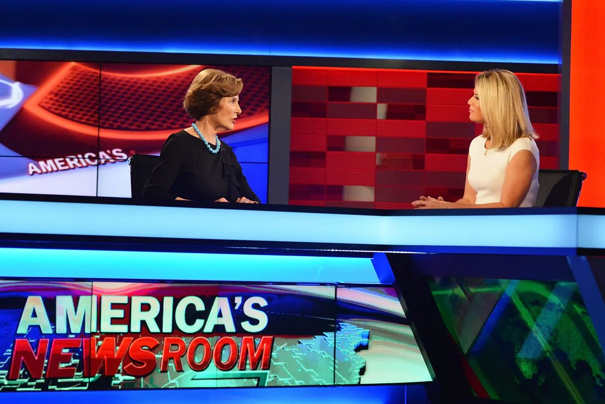 Former First Lady of the United States Laura Bush (L) talks to Fox News anchor Martha MacCallum at FOX's 'America's Newsroom' at FOX Studios on September 24, 2014 in New York City. (Photo by Slaven Vlasic/Getty Images)
