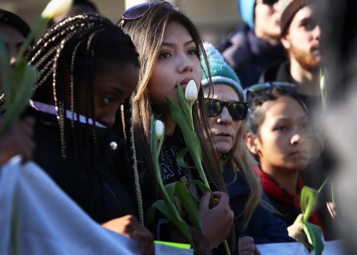 People protest the shooting death of Tony Robinson, in Madison, Wis. on March 7, 2015. Robinson, an unarmed black 19-year-old, was fatally shot Friday by Matt Kenny, a white police officer, the Madison police chief said. (AP Photo/Wisconsin State Journal, John Hart)