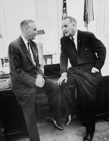 President Lyndon B. Johnson (R) confers in the White House with the U.S. Ambassador to South Vietnam Gen. Maxwell Taylor (L) on Aug. 8, 1965. (AFP/AFP/Getty Images)