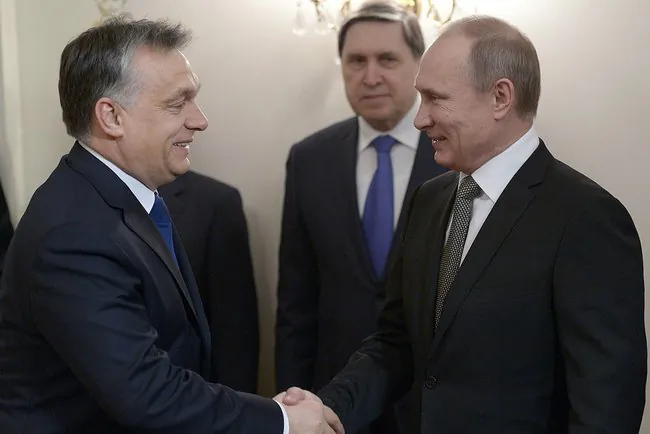 An energetic handshake between Viktor Orban and Vladimir Putin  (via Wikimedia)