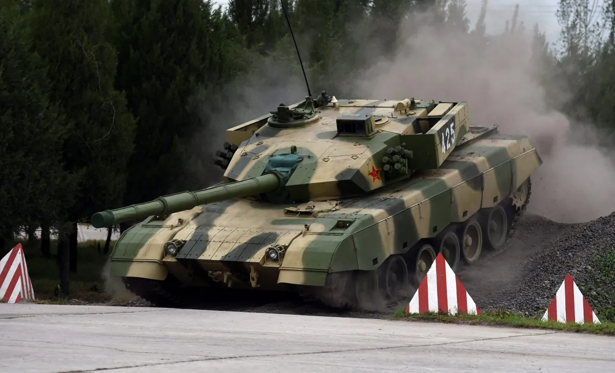 One of China’s modern tanks crosses an obstacle during a driving demonstration at the People's Liberation Army Armored Forces Engineering Academy in Beijing on July 22, 2014. (Greg Baker/AFP/Getty Images)